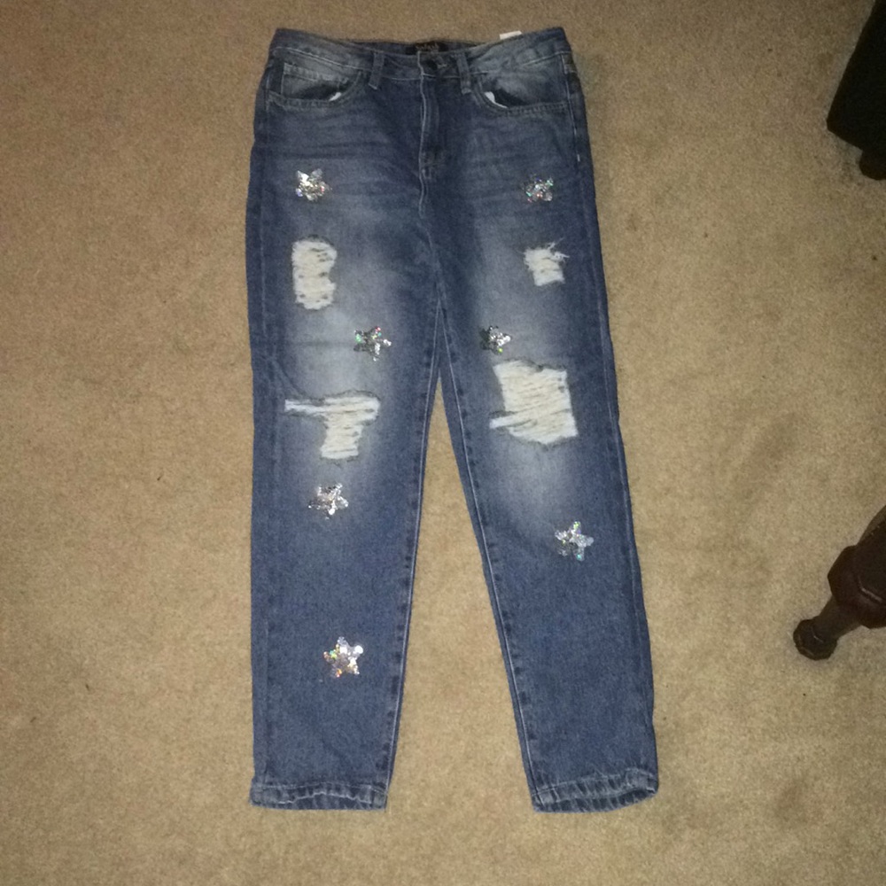 Light ripped jeans with holographic stars